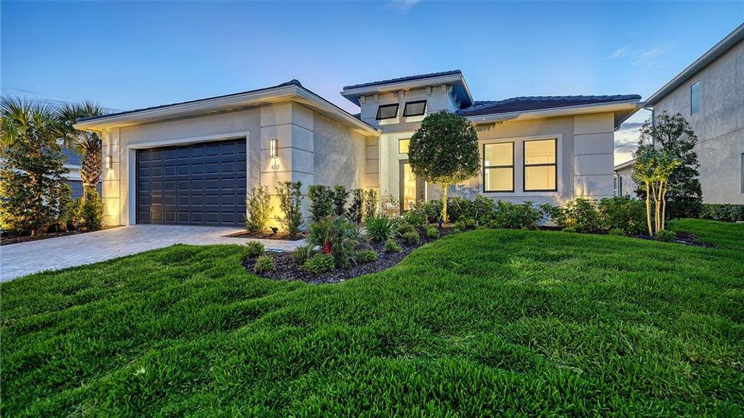Front exterior of a new home in , Sarasota, FL, highlighting curb appeal (Image 24).