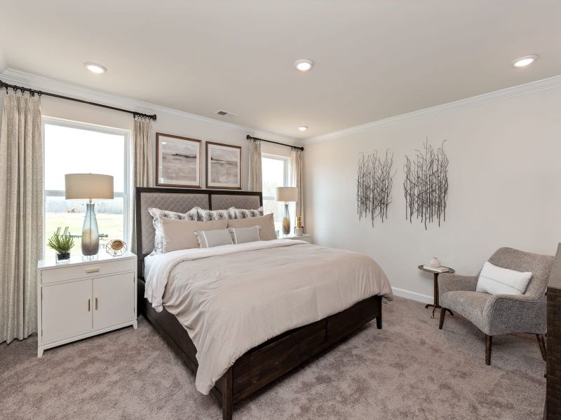 The primary suite features a luxurious walk-in closet.