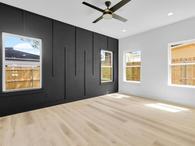 Spare room with light hardwood / wood-style floors and ceiling fan