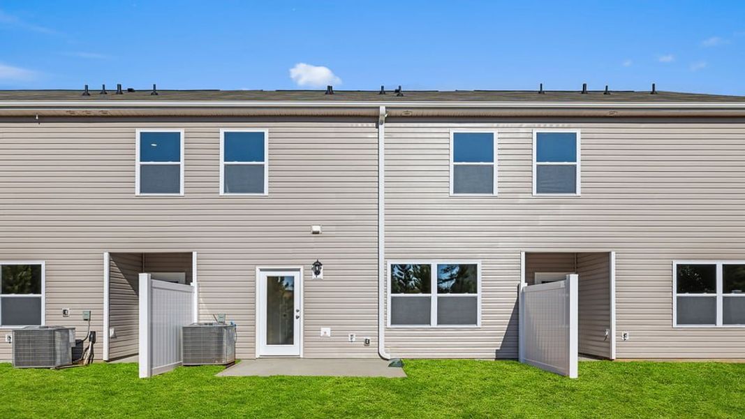 Exterior details and patio area of a home in Brookside Ridge Townhomes, Greer (Image 2). Exterior details and patio area of a home in Brookside Ridge Townhomes, Greer (Image 2).