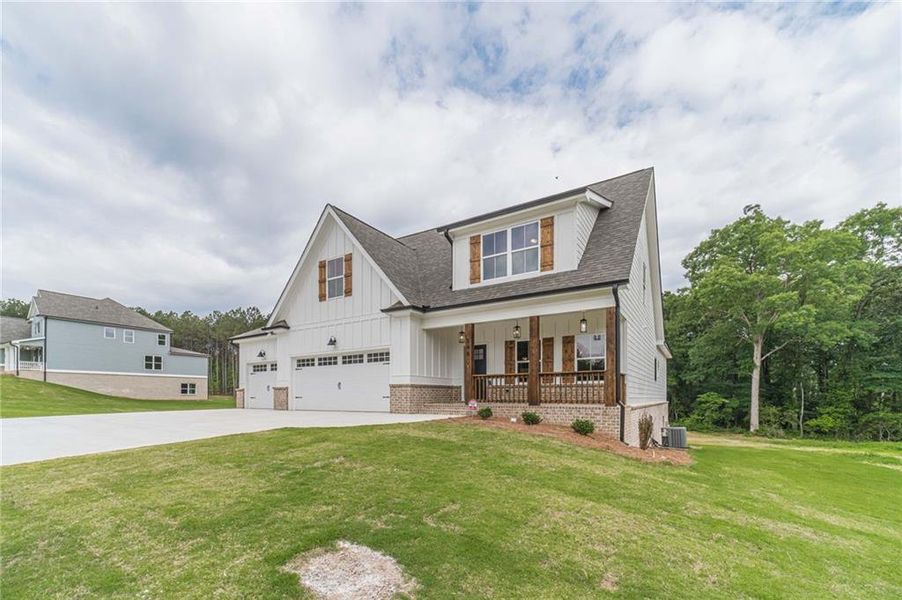 Front exterior of a new home in , Covington, GA, highlighting curb appeal (Image 1). Front exterior of a new home in , Covington, GA, highlighting curb appeal (Image 1).