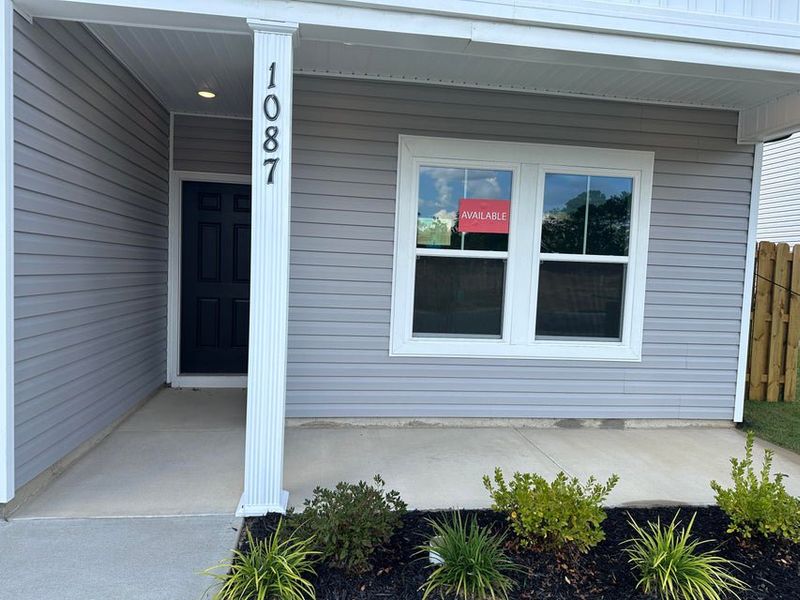 Exterior details and patio area of a home in Windsor Townhomes, North Augusta (Image 3).