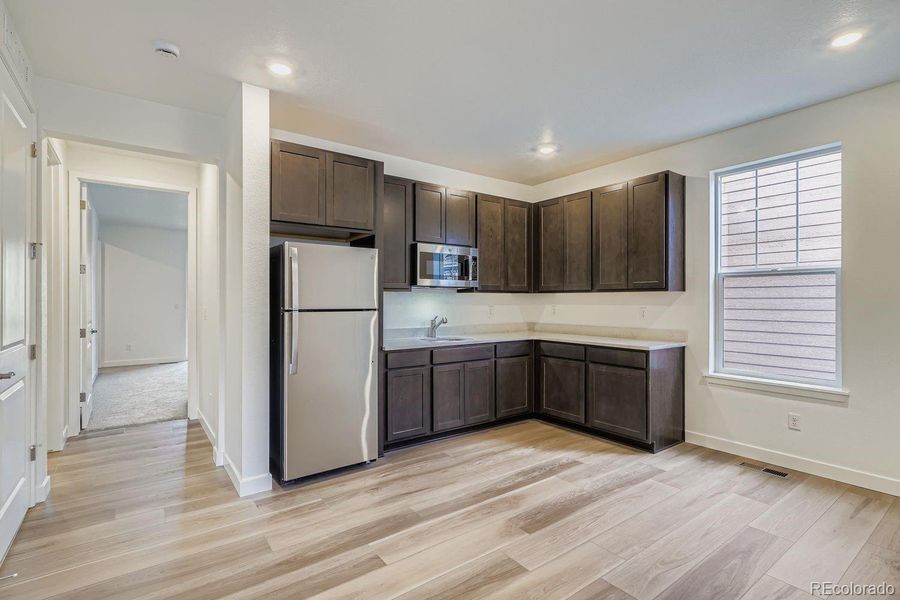 Furnished interior view inside a new home in Macanta: The Grand Collection, Castle Rock (Image 6).