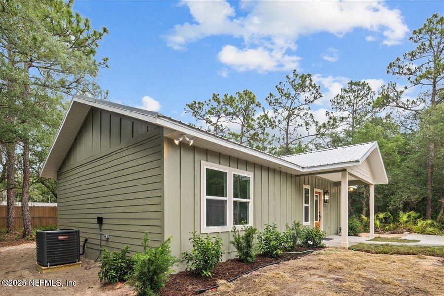 Front exterior of a new home in , Interlachen, FL, highlighting curb appeal (Image 1).