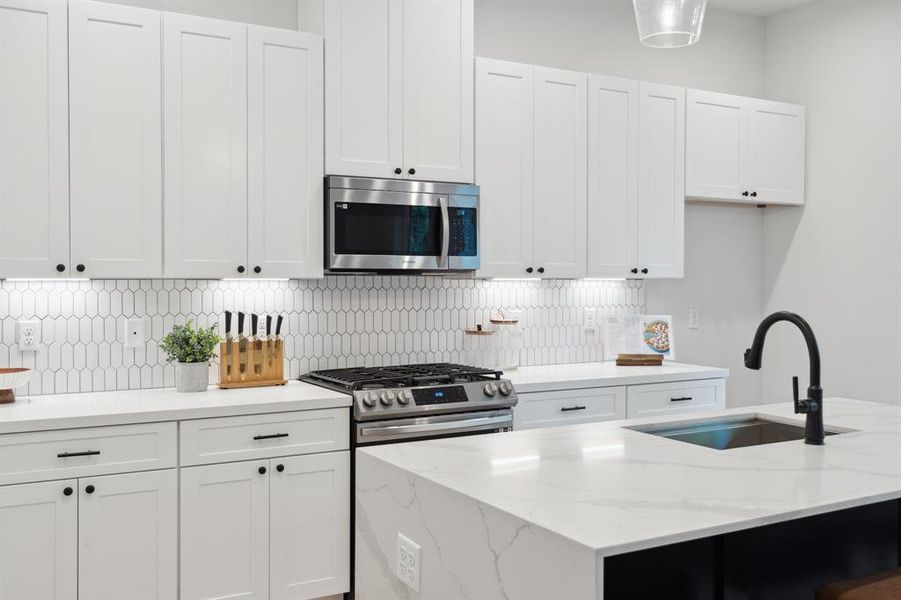 The kitchen showcases a classic farmhouse sink, expertly merging ample storage with timeless elegance for everyday functionality and style