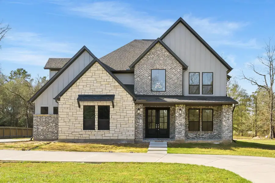Front exterior of a new home in , Montgomery, TX, highlighting curb appeal (Image 26). Front exterior of a new home in , Montgomery, TX, highlighting curb appeal (Image 26).