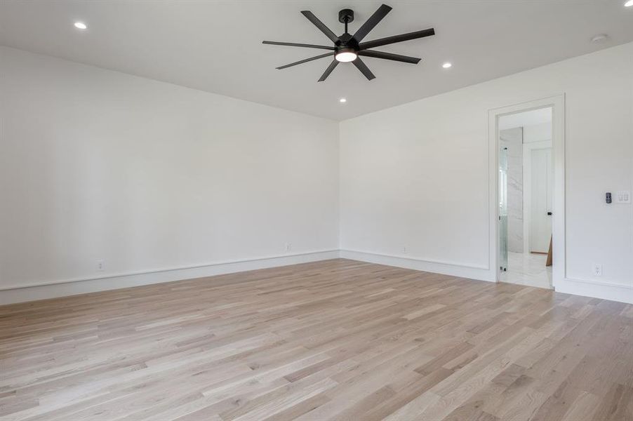 Spare room featuring light wood-style floors, recessed lighting, and ceiling fan Spare room featuring light wood-style floors, recessed lighting, and ceiling fan