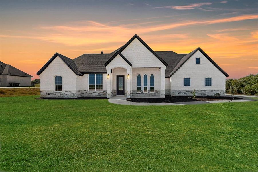 Front exterior of a new home in , Springtown, TX, highlighting curb appeal (Image 2). Front exterior of a new home in , Springtown, TX, highlighting curb appeal (Image 2).