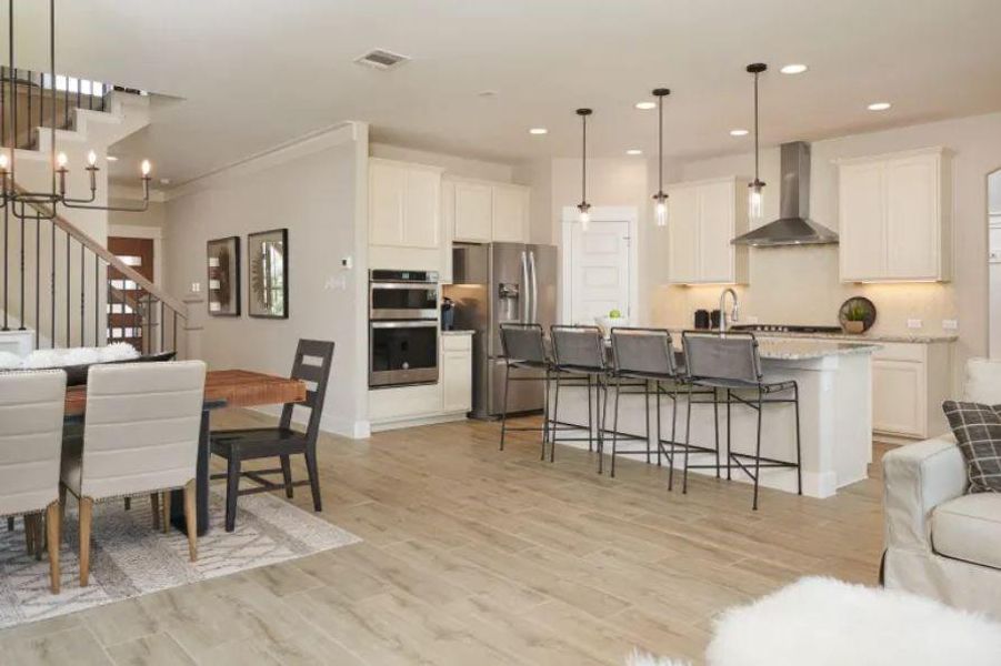 Photo of Pulte model home with same floor plan, not of actual home listed.