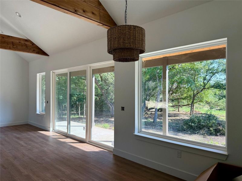 Large slider and windows with views to your wooded oasis Large slider and windows with views to your wooded oasis