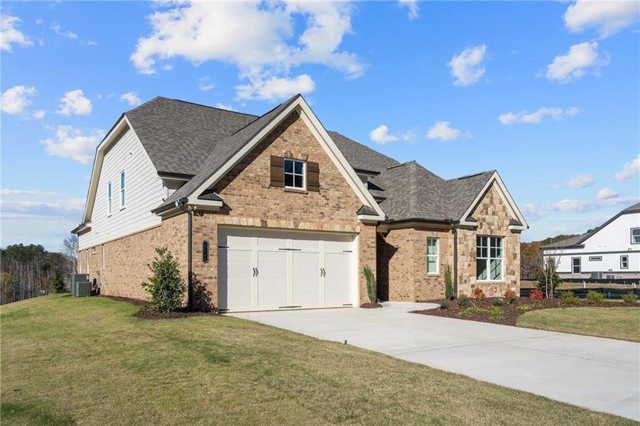 Front exterior of a new home in Yellowstone Farms, Cumming, GA, highlighting curb appeal (Image 25).