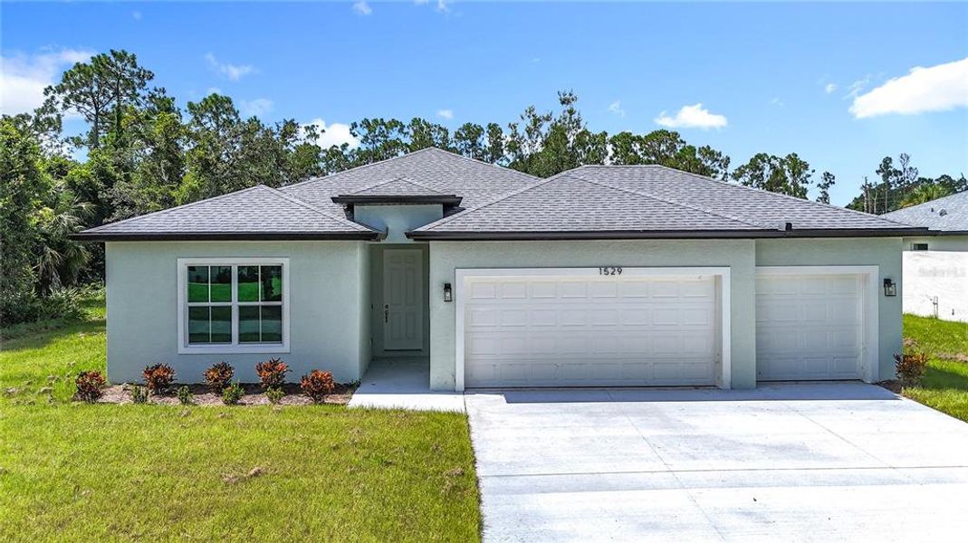 Front exterior of a new home in , North Port, FL, highlighting curb appeal (Image 1).