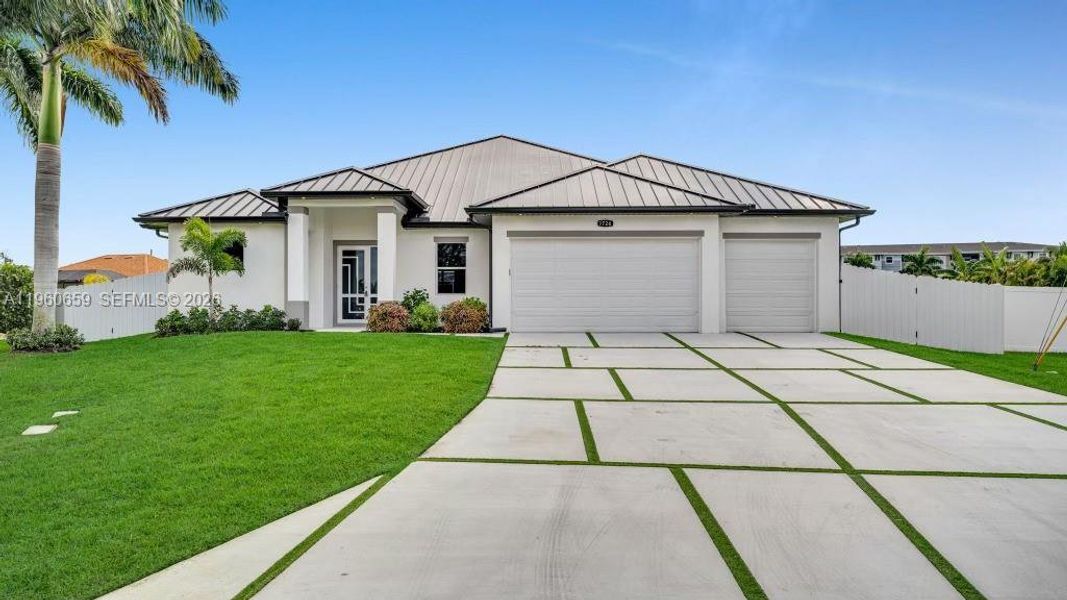 Front exterior of a new home in , Cape Coral, FL, highlighting curb appeal (Image 1). Front exterior of a new home in , Cape Coral, FL, highlighting curb appeal (Image 1).