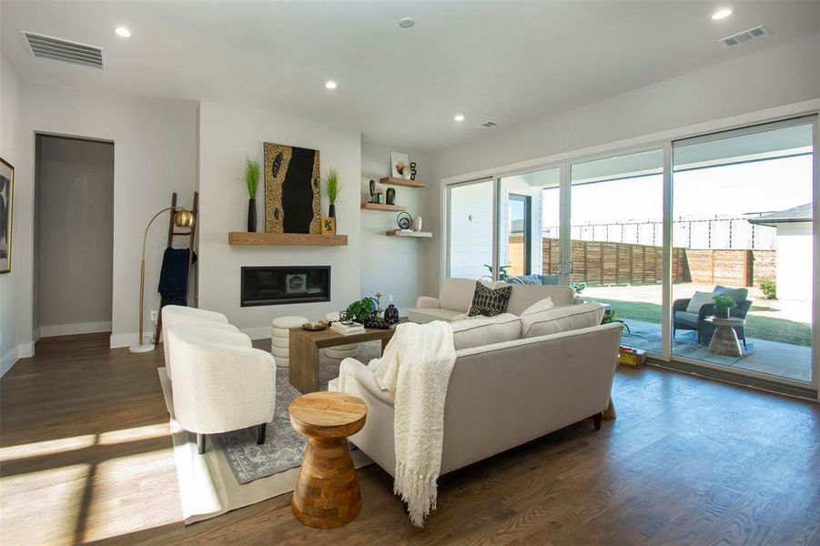 Living room with dark hardwood / wood-style flooring