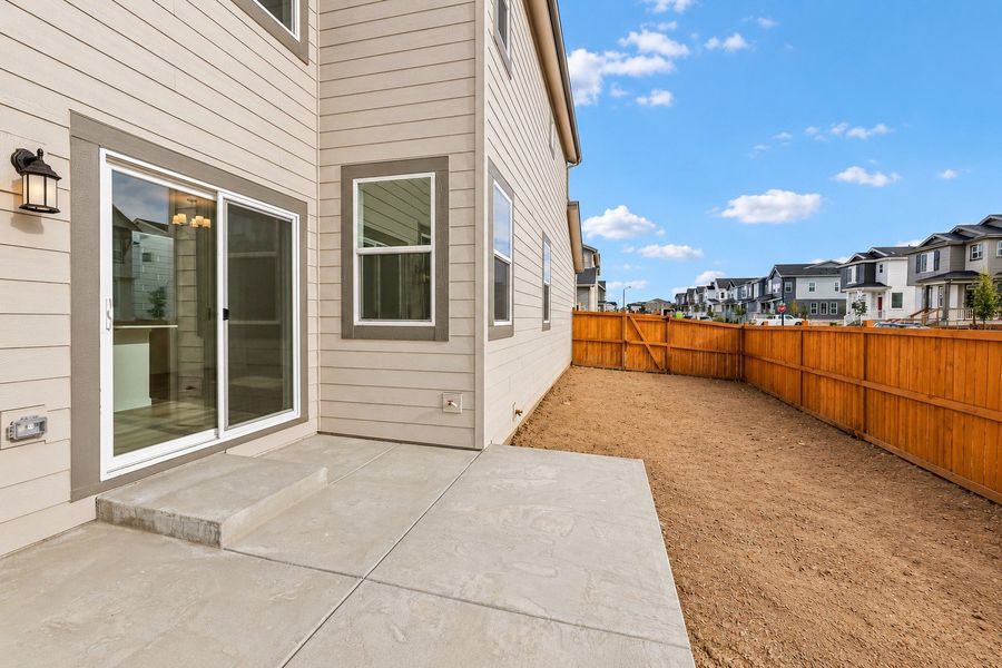 Exterior details and patio area of a home in Sky Ranch, Watkins (Image 3).