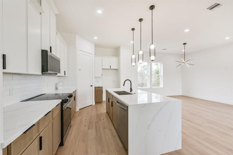 Plenty of counter and cabinet space, plus a coffee bar next to the refrigerator space.