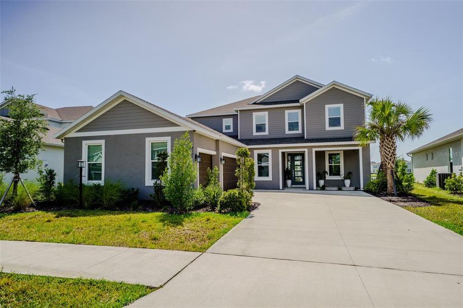 Front exterior of a new home in , Sarasota, FL, highlighting curb appeal (Image 2). Front exterior of a new home in , Sarasota, FL, highlighting curb appeal (Image 2).