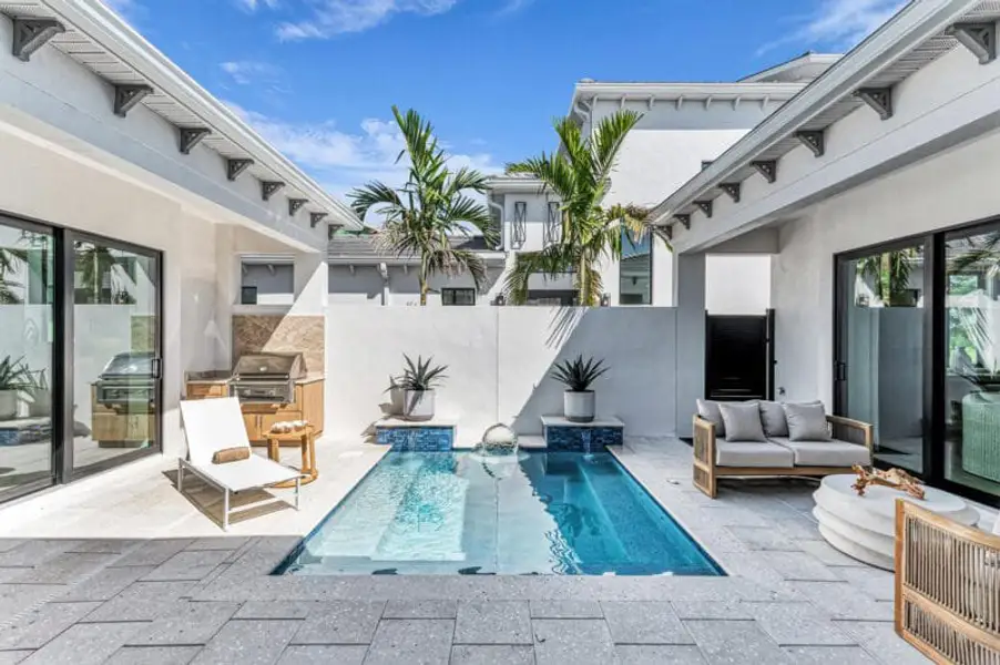 Exterior details and patio area of a home in Aqua, Bradenton (Image 2).