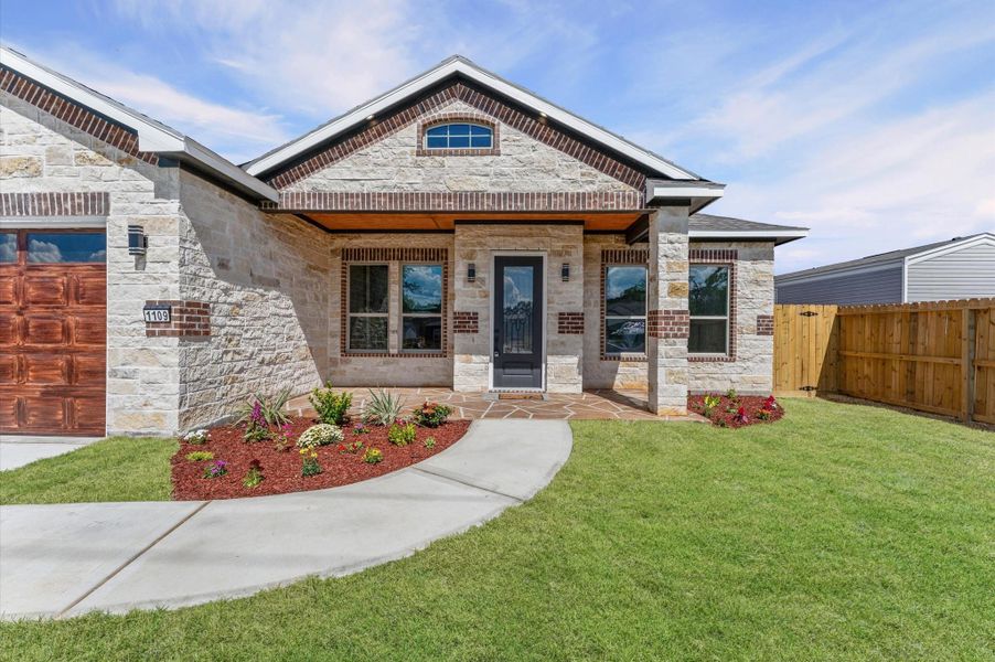 Wide front porch with wood ceiling detail — a perfect spot to enjoy your morning coffee or evening breeze. Wide front porch with wood ceiling detail — a perfect spot to enjoy your morning coffee or evening breeze.