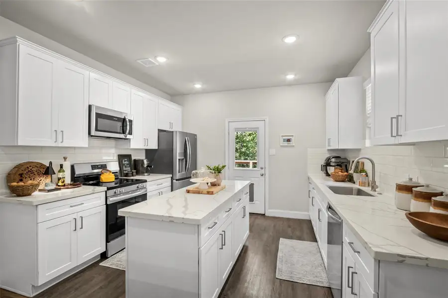 Furnished interior view inside a new home in , Conroe (Image 6).