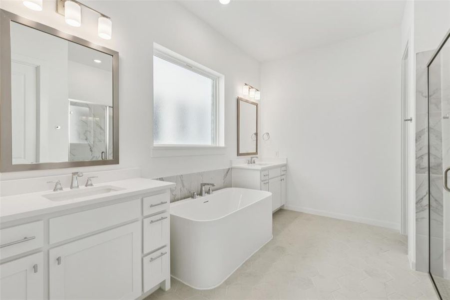 His and her vanities provide ample space for two in this dream owner's bath! His and her vanities provide ample space for two in this dream owner's bath!