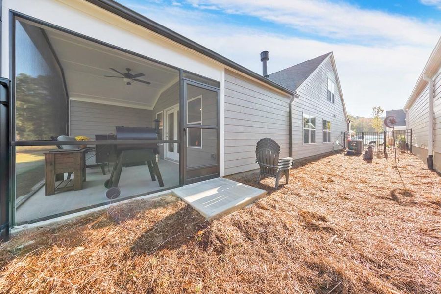 Exterior details and patio area of a home in Madeira, Acworth (Image 24).