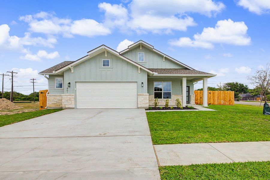 Front exterior of a new home in TerraVista, Victoria, TX, highlighting curb appeal (Image 27). Front exterior of a new home in TerraVista, Victoria, TX, highlighting curb appeal (Image 27).
