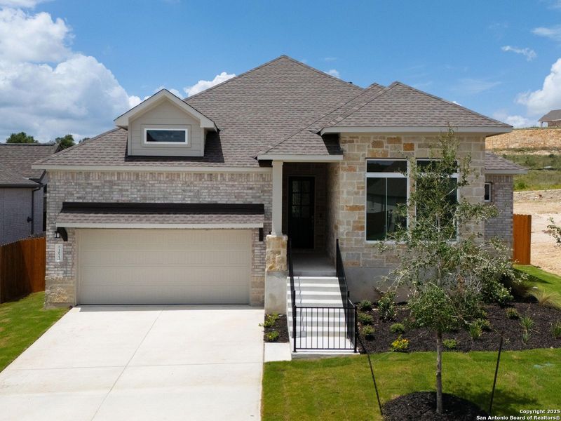 Front exterior of a new home in Meyer Ranch, New Braunfels, TX, highlighting curb appeal (Image 20).