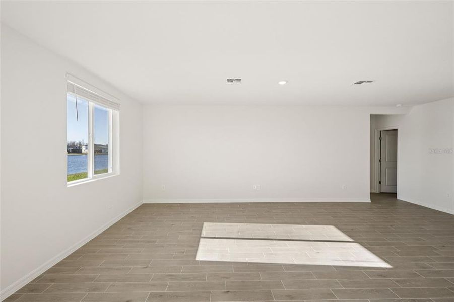 Spacious, unfurnished interior of a new home in The Grove at Stuart Crossing - Classic Series, Bartow (Image 26).