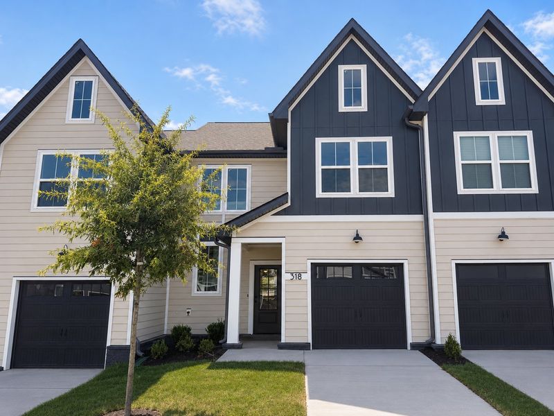 Front exterior of a new home in Tiger Hill Townhomes, Murfreesboro, TN, highlighting curb appeal (Image 2). Front exterior of a new home in Tiger Hill Townhomes, Murfreesboro, TN, highlighting curb appeal (Image 2).