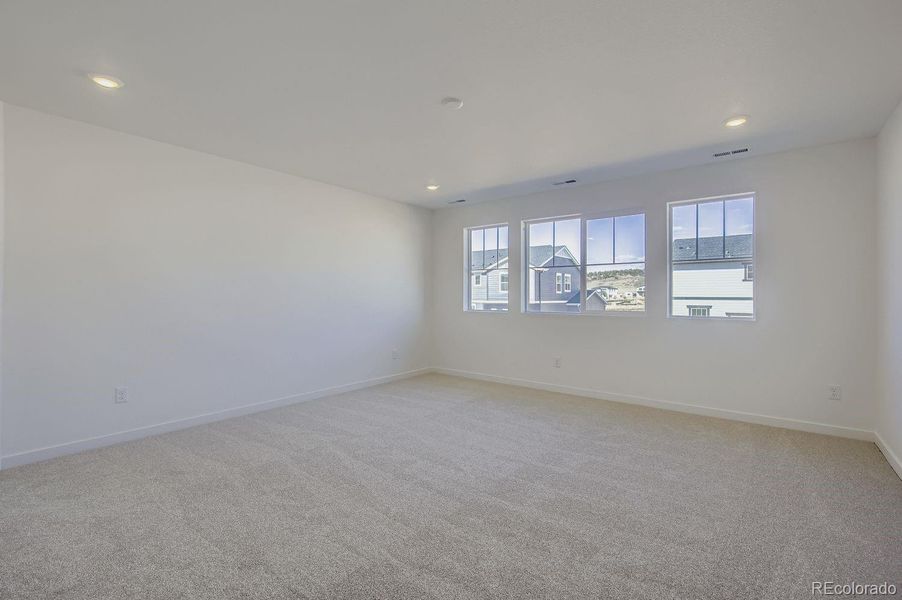 Spacious, unfurnished interior of a new home in Riano Ridge: The Monarch Collection, Loveland (Image 11).