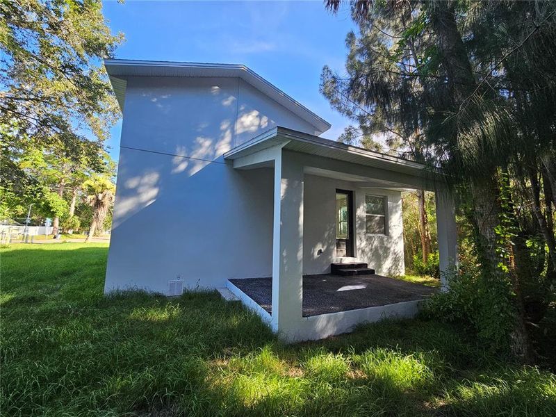 Front exterior of a new home in , New Smyrna Beach, FL, highlighting curb appeal (Image 1).