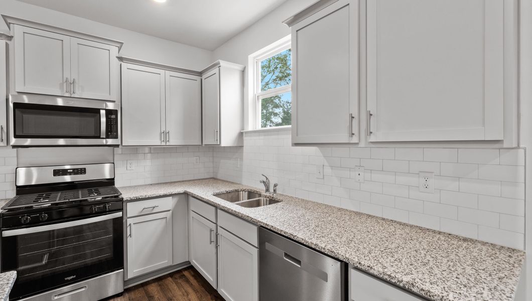 Representative furnished interior of a home built from the Biltmore by D.R. Horton in Woodglen, Piedmont (Image 8).