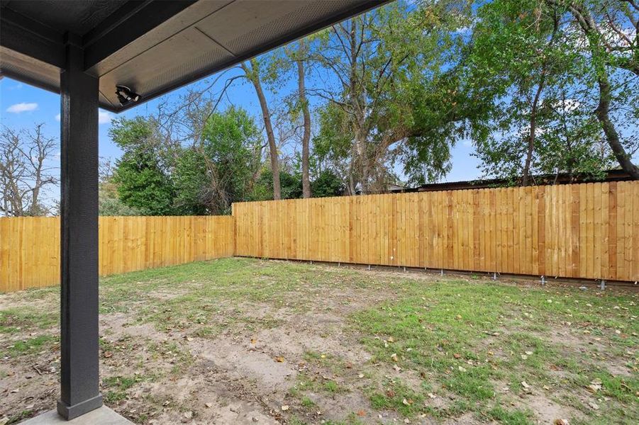 View of fenced backyard
