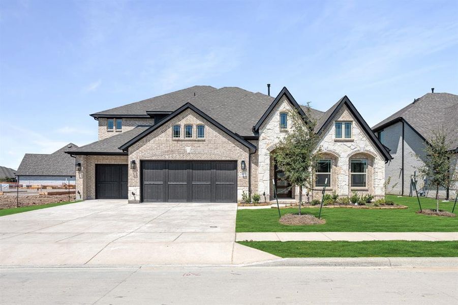Front exterior of a new home in Devonshire Classic 60-65, Forney, TX, highlighting curb appeal (Image 25). Front exterior of a new home in Devonshire Classic 60-65, Forney, TX, highlighting curb appeal (Image 25).