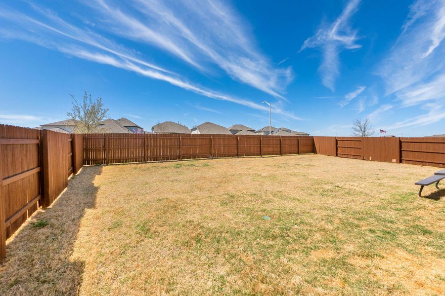 View of yard featuring a fenced backyard