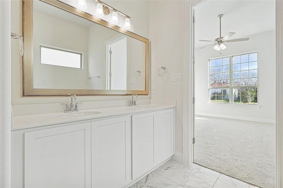 Bathroom featuring vanity and ceiling fan