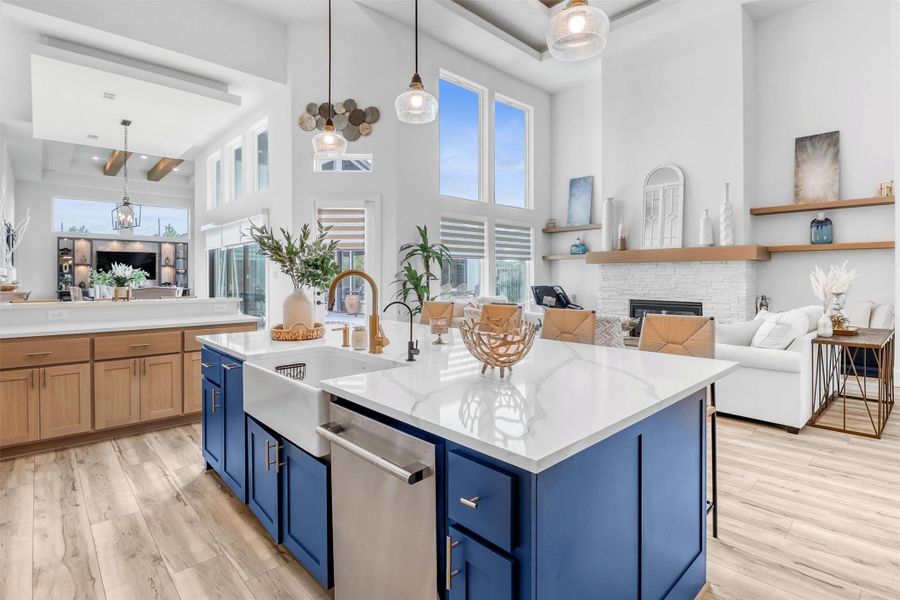 From this vantage point, notice the double tray ceiling in the living room, the drop ceiling in the dining area, and the double tray ceiling and hardwood beams in the game area. Every detail of this home is truly spectacular.