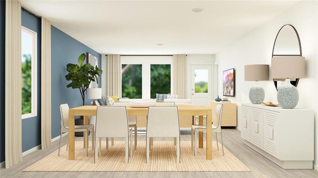 Dining room featuring plenty of natural light and light hardwood / wood-style flooring