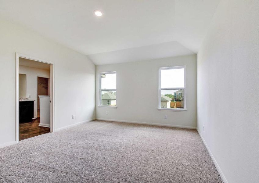 Rio family room with two backyard windows, light gray carpet, and overhead can light