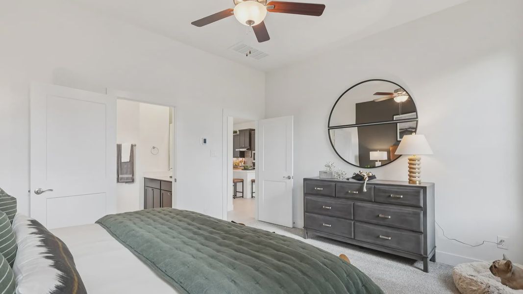 Representative furnished interior of a home built from the Adele by Chesmar Homes in Sunterra, Katy (Image 15).