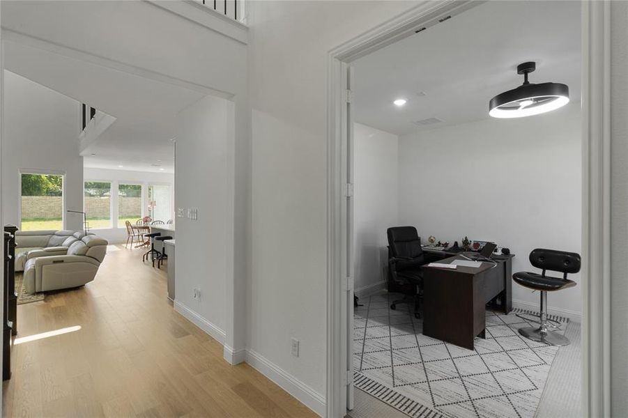 Dedicated room featuring geometric pattern tile flooring, recessed lighting, and a modern ceiling light fixture