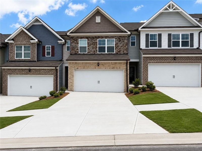 Front exterior of a new home in Somerset at Riverbrook, Gainesville, GA, highlighting curb appeal (Image 2). Front exterior of a new home in Somerset at Riverbrook, Gainesville, GA, highlighting curb appeal (Image 2).
