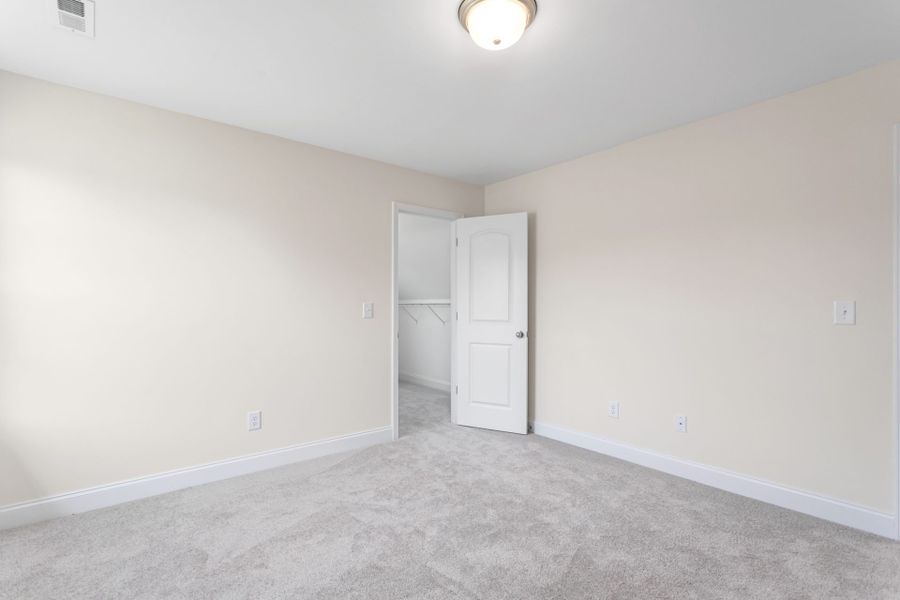 Representative unfurnished interior of a home built from the Jamestown by Keystone Homes NC in Sullivans Reserve, Walkertown (Image 39).