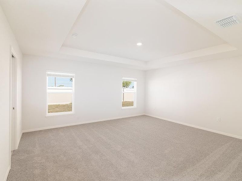 Your spacious owner`s suite features a tray ceiling, a walk-in closet, and an en-suite bath. Your spacious owner`s suite features a tray ceiling, a walk-in closet, and an en-suite bath.