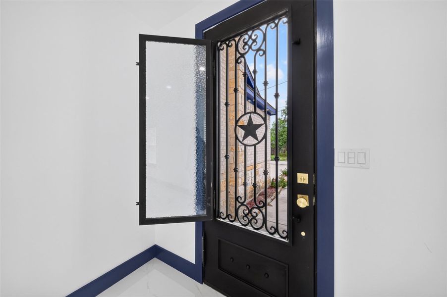 Statement front door opens to a bright and welcoming entryway