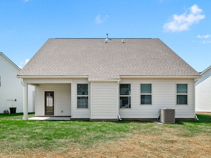 Exterior details and patio area of a home in Woods Crossing, Gallatin (Image 32).