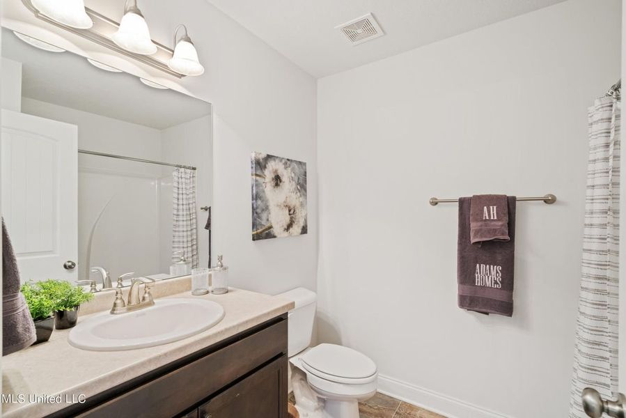 Representative furnished interior of a home built from the 1425 by Adams Homes in Sandy Creek, Pace (Image 12). Representative furnished interior of a home built from the 1425 by Adams Homes in Sandy Creek, Pace (Image 12).