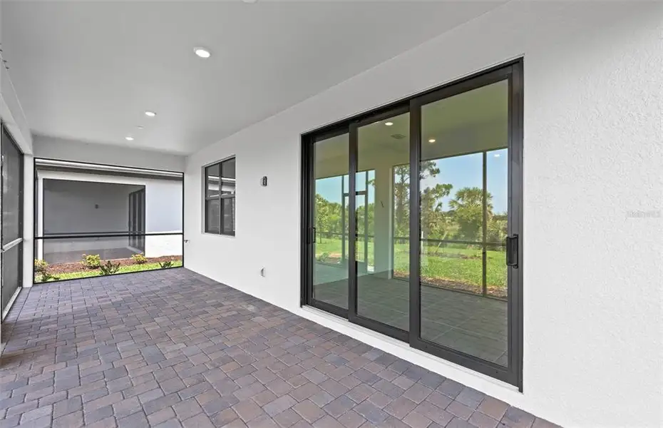 Exterior details and patio area of a home in Talon Preserve on Palmer Ranch, Nokomis (Image 3).