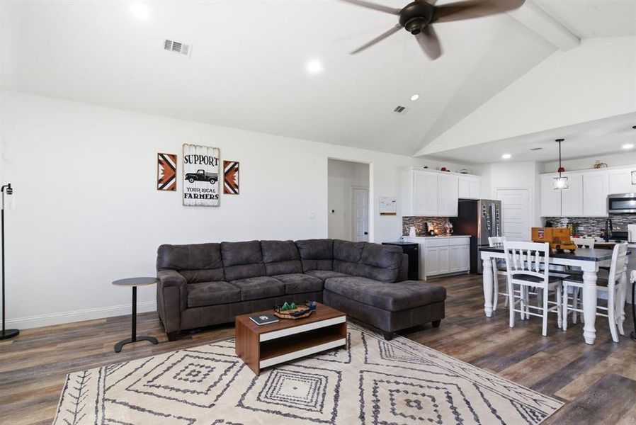 Living room with ceiling fan, dark wood-style flooring, and recessed lighting Living room with ceiling fan, dark wood-style flooring, and recessed lighting